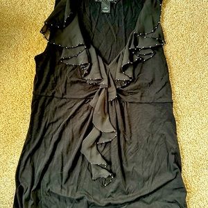 White House black market. Sleeveless shirt with decorative silver.